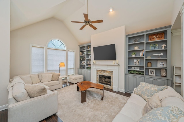 4467 Turnberry Pl, Niceville, FL 32578 - living area featuring a ceiling fan, a fireplace, dark wood finished floors, vaulted ceiling, and baseboards