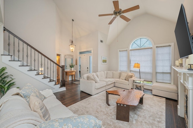 4467 Turnberry Pl, Niceville, FL 32578 - living room with wood finished floors, high vaulted ceiling, stairs, and a ceiling fan