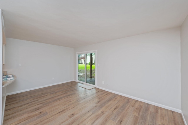 308 Miracle Strip Pkwy Unit 16B, Fort Walton Beach, FL 32548 - spare room with baseboards and light wood-style floors