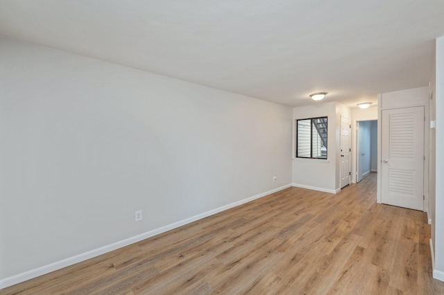 308 Miracle Strip Pkwy Unit 16B, Fort Walton Beach, FL 32548 - unfurnished room with baseboards and light wood finished floors