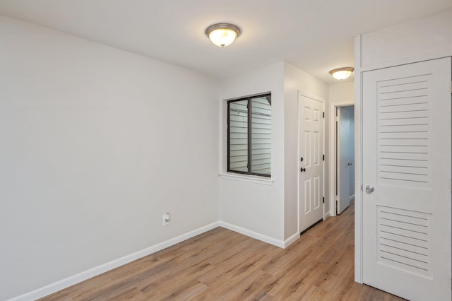 308 Miracle Strip Pkwy Unit 16B, Fort Walton Beach, FL 32548 - empty room with light wood-style floors and baseboards