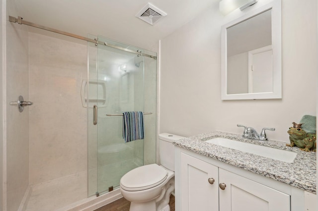 308 Miracle Strip Pkwy Unit 16B, Fort Walton Beach, FL 32548 - bathroom featuring vanity, toilet, and a stall shower