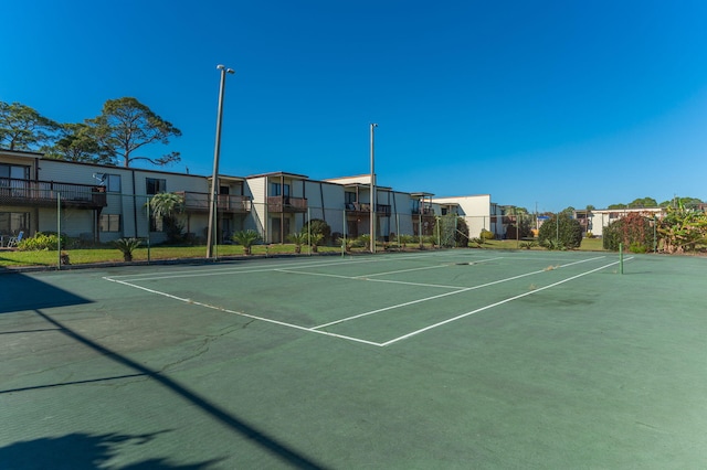 308 Miracle Strip Pkwy Unit 16B, Fort Walton Beach, FL 32548 - view of tennis court with a residential view