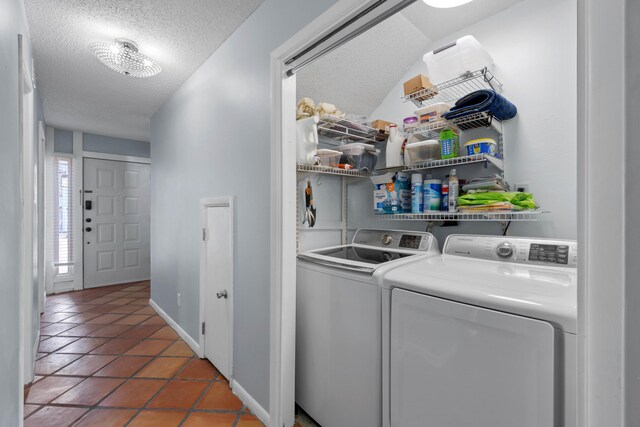 4 SW Miracle Strip Pkwy Unit 23, Fort Walton Beach, FL 32548 - laundry area featuring separate washer and dryer, a textured ceiling, tile patterned flooring, and baseboards