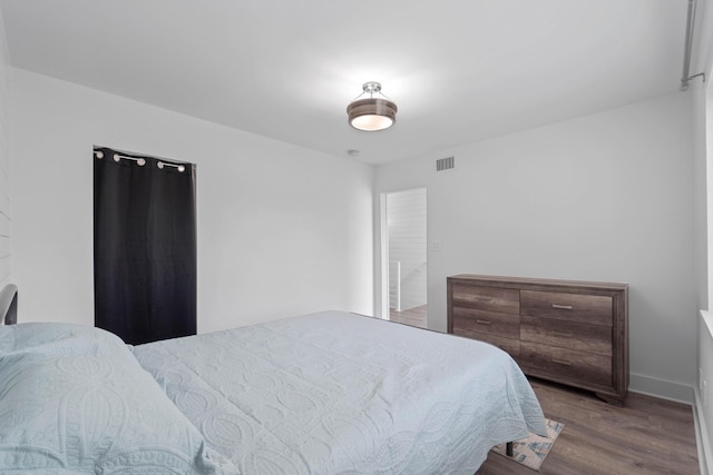 4 SW Miracle Strip Pkwy Unit 23, Fort Walton Beach, FL 32548 - bedroom with wood finished floors and baseboards
