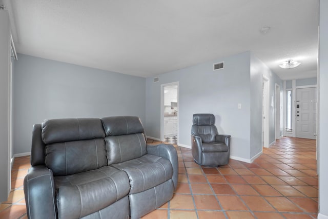 4 SW Miracle Strip Pkwy Unit 23, Fort Walton Beach, FL 32548 - living room with tile patterned floors and baseboards
