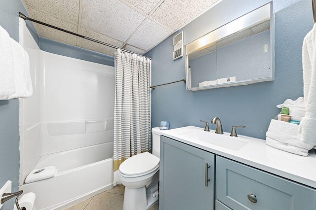 667 Nautilus Ct Unit 302, Fort Walton Beach, FL 32548 - bathroom with a paneled ceiling, vanity, toilet, shower / tub combo, and tile patterned flooring