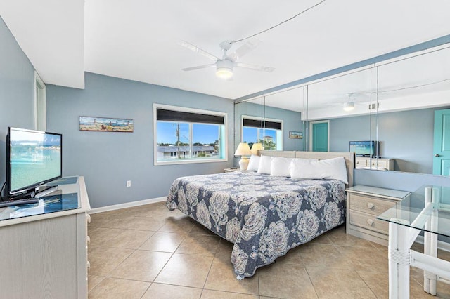667 Nautilus Ct Unit 302, Fort Walton Beach, FL 32548 - bedroom featuring tile patterned floors, baseboards, and ceiling fan