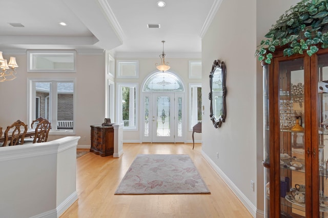 23 Paradise Point Rd, Shalimar, FL 32579 - foyer with light wood-type flooring, a chandelier, crown molding, baseboards, and recessed lighting