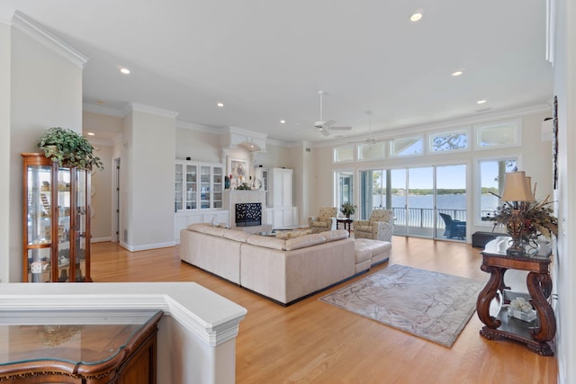 23 Paradise Point Rd, Shalimar, FL 32579 - living area with a ceiling fan, wood finished floors, recessed lighting, a fireplace, and ornamental molding