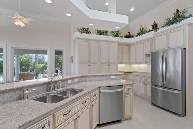 23 Paradise Point Rd, Shalimar, FL 32579 - kitchen with appliances with stainless steel finishes, cream cabinets, a sink, light tile patterned flooring, and ornamental molding