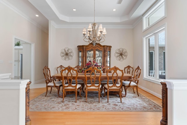 23 Paradise Point Rd, Shalimar, FL 32579 - dining area featuring a chandelier, light wood-style flooring, a tray ceiling, baseboards, and recessed lighting