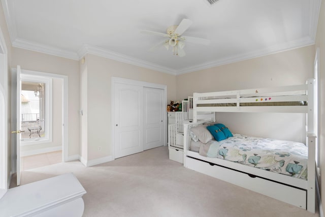 23 Paradise Point Rd, Shalimar, FL 32579 - bedroom with light carpet, crown molding, a closet, ceiling fan, and baseboards