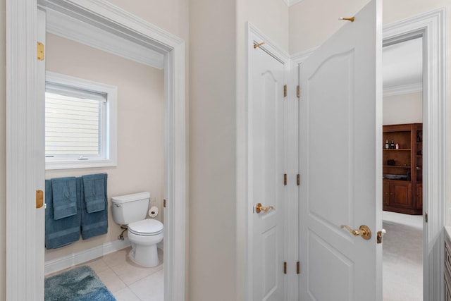 23 Paradise Point Rd, Shalimar, FL 32579 - bathroom with toilet, crown molding, tile patterned floors, and baseboards