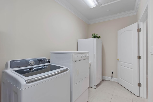 23 Paradise Point Rd, Shalimar, FL 32579 - laundry area with washer and dryer, crown molding, and light tile patterned floors
