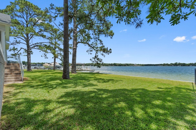23 Paradise Point Rd, Shalimar, FL 32579 - view of grassy yard with stairs and a water view
