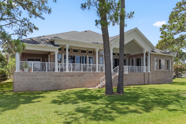23 Paradise Point Rd, Shalimar, FL 32579 - rear view of property featuring brick siding and a lawn