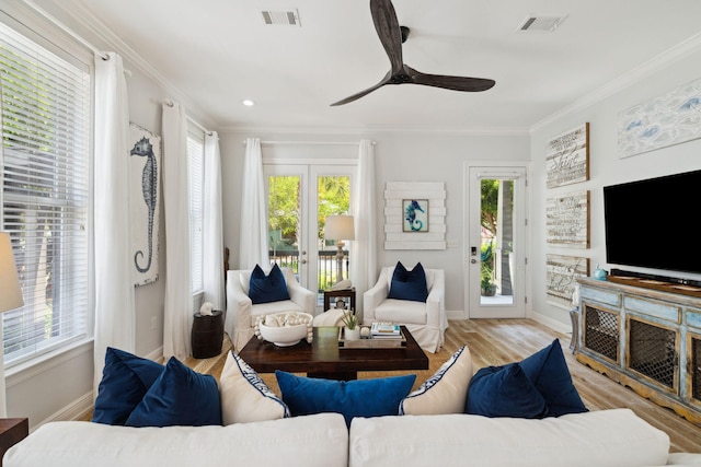 300 Cassine Garden Cir, Santa Rosa Beach, FL 32459 - living area with ornamental molding, wood finished floors, and a ceiling fan