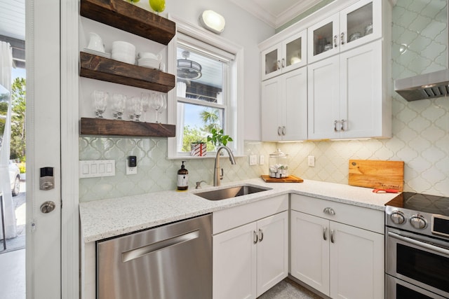 300 Cassine Garden Cir, Santa Rosa Beach, FL 32459 - kitchen featuring open shelves, appliances with stainless steel finishes, wall chimney range hood, backsplash, and white cabinets
