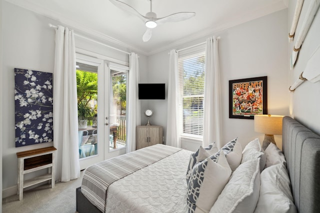 300 Cassine Garden Cir, Santa Rosa Beach, FL 32459 - bedroom featuring multiple windows, access to exterior, ornamental molding, light colored carpet, and french doors