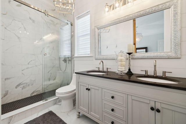 300 Cassine Garden Cir, Santa Rosa Beach, FL 32459 - bathroom featuring marble look tile flooring, a marble finish shower, double vanity, and healthy amount of natural light
