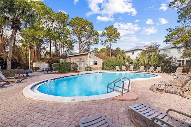 300 Cassine Garden Cir, Santa Rosa Beach, FL 32459 - community pool with a patio area