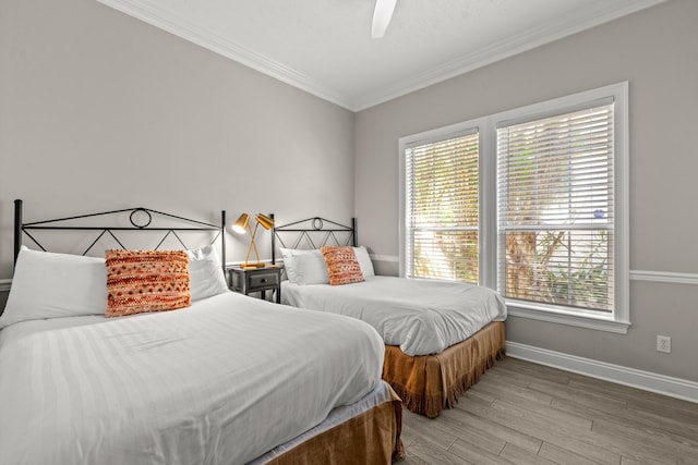 72 Tranquility Ln, Destin, FL 32541 - bedroom with crown molding, multiple windows, light wood-type flooring, baseboards, and ceiling fan