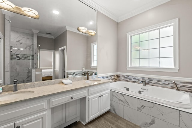 72 Tranquility Ln, Destin, FL 32541 - full bath featuring double vanity, a garden tub, a marble finish shower, wood finished floors, and ensuite bath