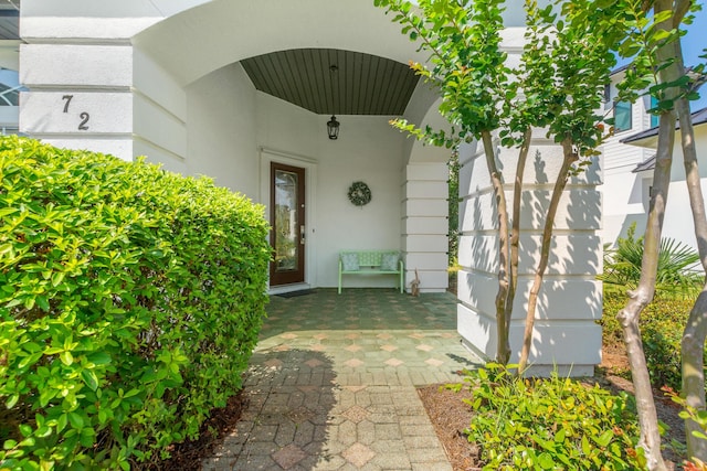 72 Tranquility Ln, Destin, FL 32541 - doorway to property with stucco siding