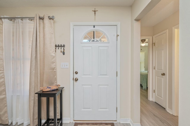 642 Alysheba Dr, Crestview, FL 32539 - foyer with wood finished floors and baseboards