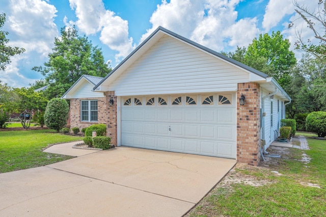 642 Alysheba Dr, Crestview, FL 32539 - view of front facade with brick siding, a front lawn, driveway, and an attached garage