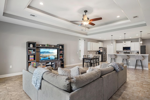801 Playground Rd, Fort Walton Beach, FL 32547 - living area with a raised ceiling, crown molding, ceiling fan, recessed lighting, and baseboards