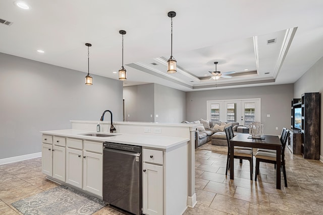 801 Playground Rd, Fort Walton Beach, FL 32547 - kitchen with stainless steel dishwasher, a sink, ceiling fan, a raised ceiling, and open floor plan