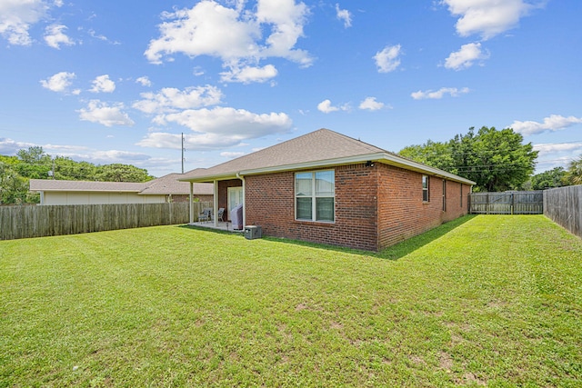 801 Playground Rd, Fort Walton Beach, FL 32547 - rear view of house featuring brick siding, central air condition unit, and roof with shingles
