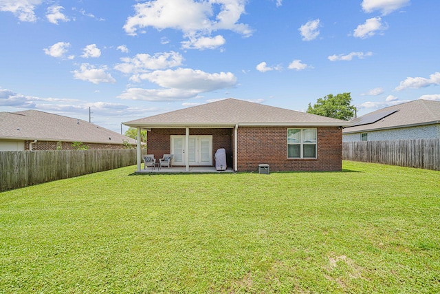 801 Playground Rd, Fort Walton Beach, FL 32547 - rear view of house featuring french doors, a patio area, and brick siding