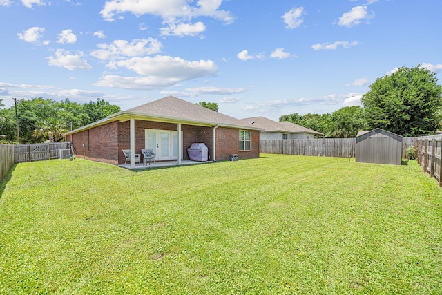 801 Playground Rd, Fort Walton Beach, FL 32547 - view of yard featuring french doors, a patio area, and central AC