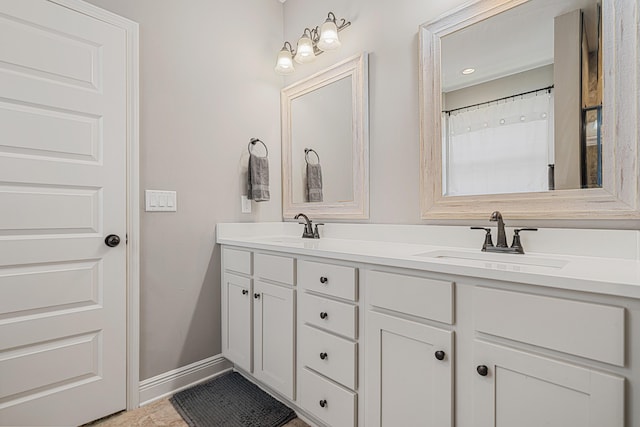 801 Playground Rd, Fort Walton Beach, FL 32547 - bathroom with double vanity and baseboards
