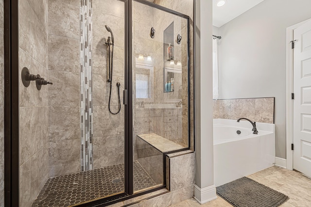 801 Playground Rd, Fort Walton Beach, FL 32547 - full bathroom featuring a shower stall, a bath, and baseboards