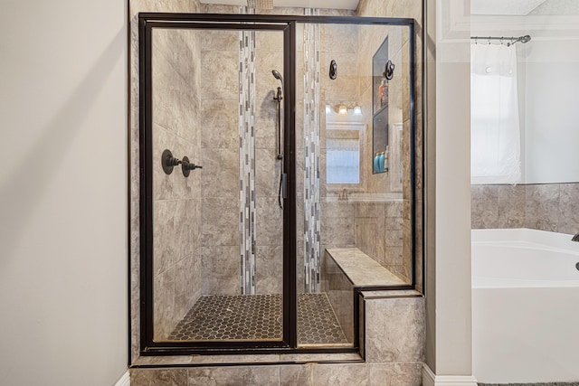 801 Playground Rd, Fort Walton Beach, FL 32547 - bathroom with a bath, a shower stall, and baseboards
