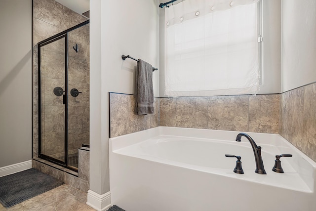 801 Playground Rd, Fort Walton Beach, FL 32547 - full bathroom with a stall shower, a bath, and baseboards