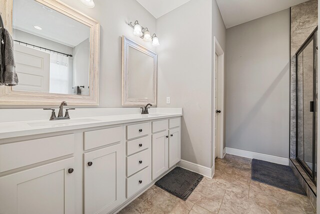 801 Playground Rd, Fort Walton Beach, FL 32547 - bathroom with double vanity, a shower stall, and baseboards