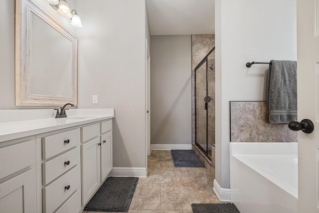 801 Playground Rd, Fort Walton Beach, FL 32547 - bathroom featuring a shower stall, a bath, vanity, and baseboards