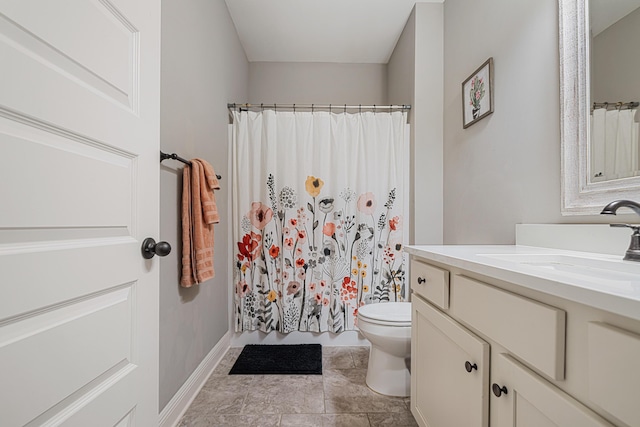 801 Playground Rd, Fort Walton Beach, FL 32547 - full bathroom with vanity, toilet, baseboards, and a shower with shower curtain
