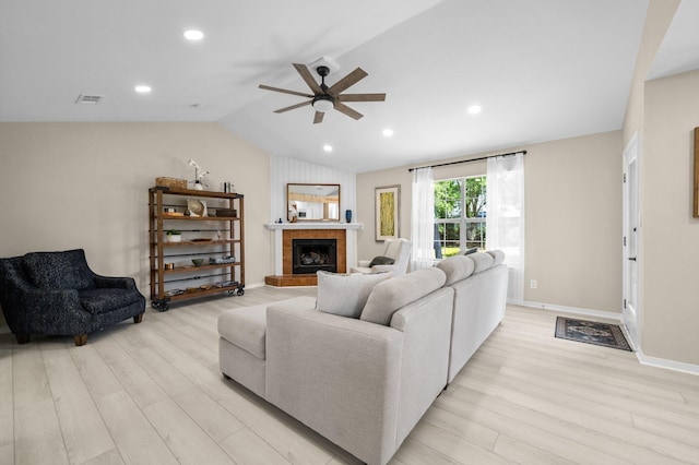 112 Meigs Dr, Shalimar, FL 32579 - living room with light wood-type flooring, a ceiling fan, vaulted ceiling, a tile fireplace, and recessed lighting