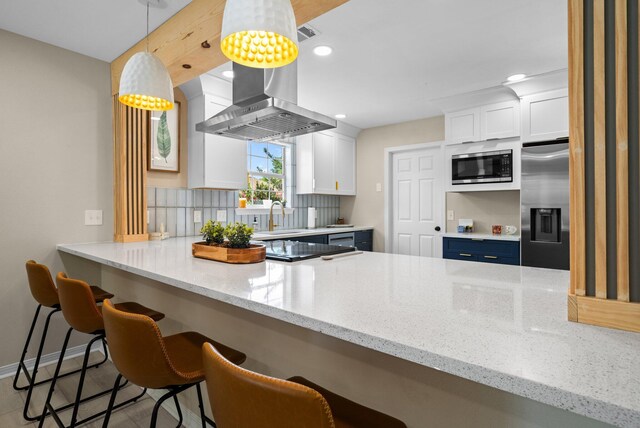 112 Meigs Dr, Shalimar, FL 32579 - kitchen with appliances with stainless steel finishes, a sink, decorative backsplash, white cabinets, and recessed lighting