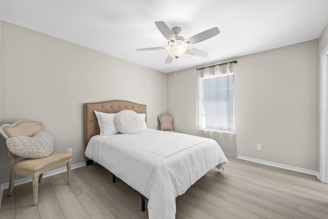 112 Meigs Dr, Shalimar, FL 32579 - bedroom featuring baseboards, light wood-type flooring, and a ceiling fan
