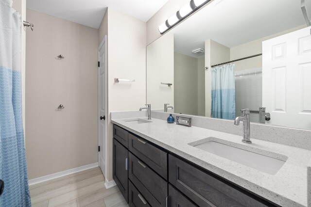 112 Meigs Dr, Shalimar, FL 32579 - full bath featuring double vanity, baseboards, and curtained shower