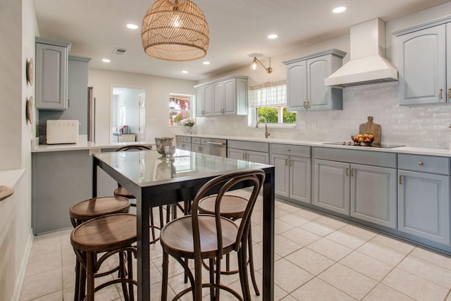1050 Edgewater Ln, Gulf Breeze, FL 32563 - kitchen featuring custom exhaust hood, gray cabinets, dishwasher, backsplash, and light tile patterned floors