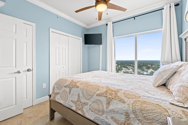 16819 Front Beach Rd Unit 2300, Panama City Beach, FL 32413 - bedroom with ornamental molding, a closet, light tile patterned floors, ceiling fan, and baseboards