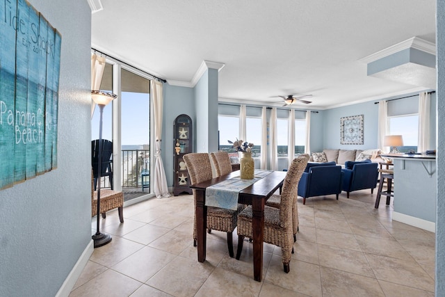 16819 Front Beach Rd Unit 2300, Panama City Beach, FL 32413 - dining room with ornamental molding, a textured wall, baseboards, ceiling fan, and light tile patterned floors